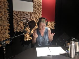 Carol McCaffrey in the WERA studio recording “The Old Nurse's Story”